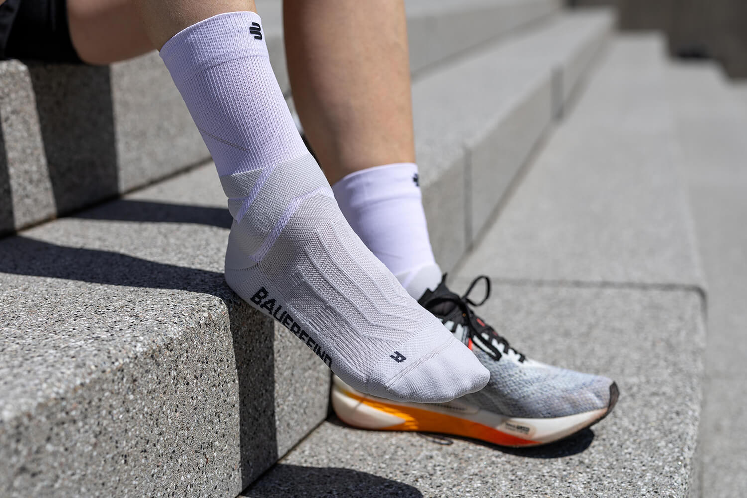 Runner wearing Run Performance Socks running up steps