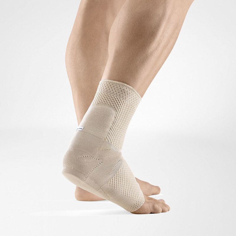 Close-up view of a modern orthopedic walking boot showing adjustable straps and sturdy sole for foot injury recovery.