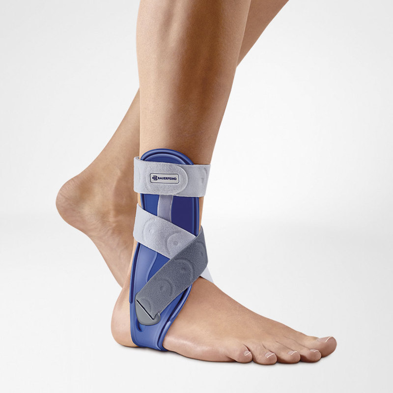 MalleoLoc Stirrup Ankle Brace  Close-up of a men wearing a blue and gray ankle stirrup brace for support and injury recovery