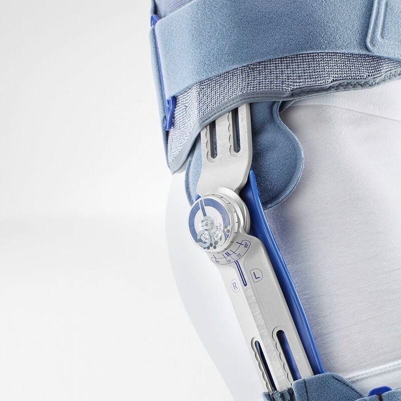 Close-up view of a modern prosthetic knee joint mechanism highlighting its intricate design and calibration markings.