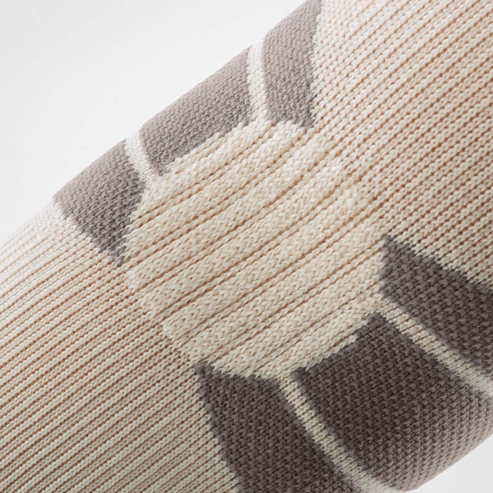 Comfort zone on Bauerfeind's Outdoor Compression Elbow Support in Sandstone color.