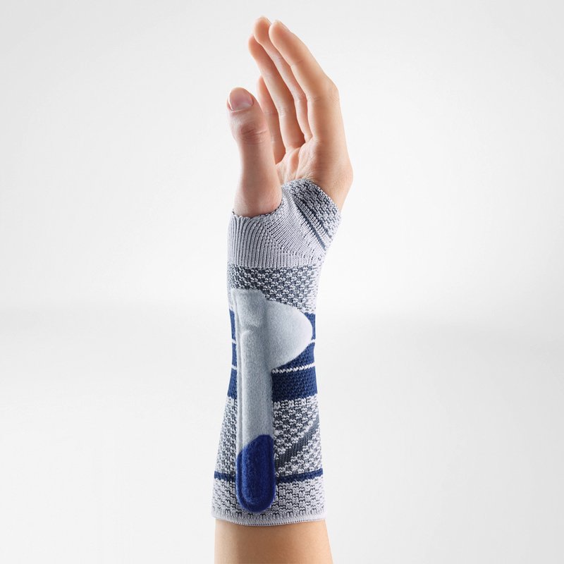 Side of a person's hand while wearing Bauerfeind's ManuTrain wrist brace without its two-part strap system.