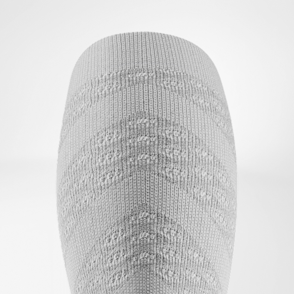 Upper edge of the white Run Performance Compression Socks.