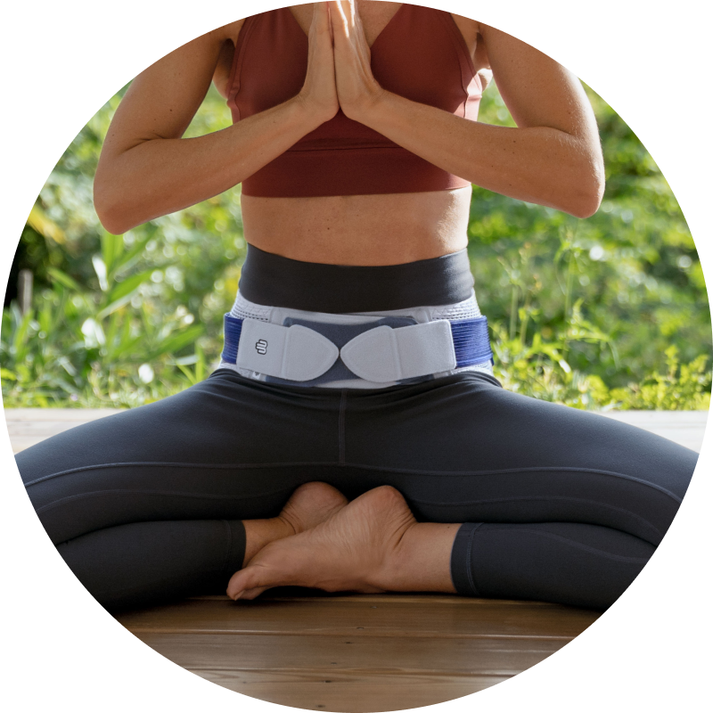 Low-Profile Person wearing Bauerfeind's SacroLoc SI joint belt while doing household chores.