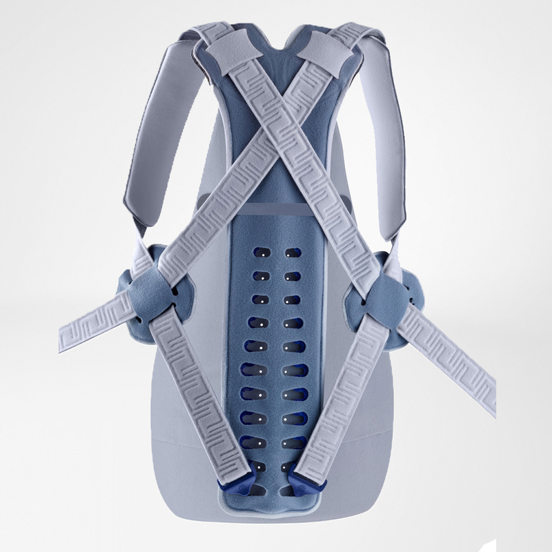 Effective Back Pain Relief with Modern Lumbar Support Brace Middle-aged woman adjusting her modern lumbar support brace looking into a mirror in a brightly lit room.
