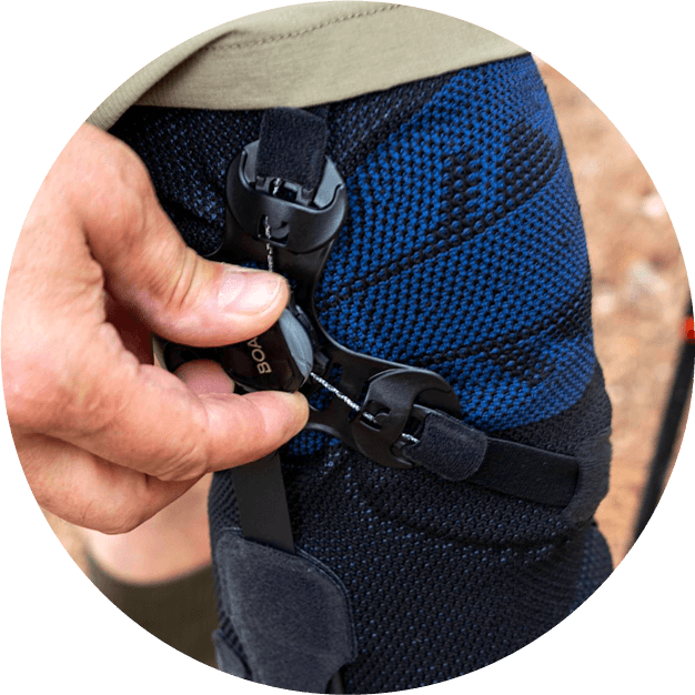 Man adjusting the BOA Fit-System on the GenuTrain OA. Circular icon of a man adjusting the BOA Fit-System on Bauerfeind's GenuTrain OA unloader knee brace.