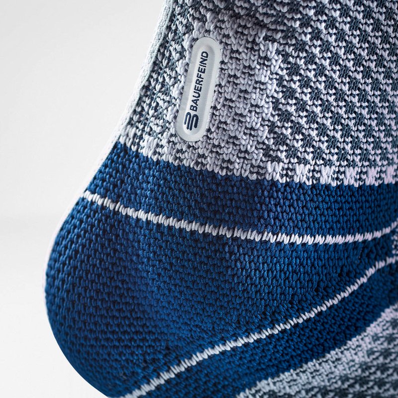 Bauerfeind MalleoTrain ankle support brace packaging with a visual of the product in use, featuring stabilization technology.