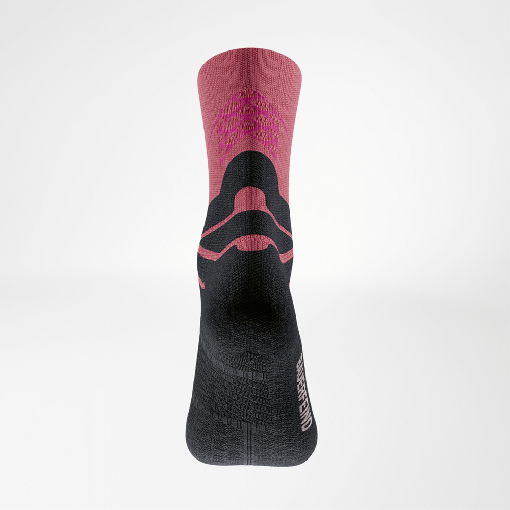 Posterior of the coral Run Performance Mid-Cut Socks.