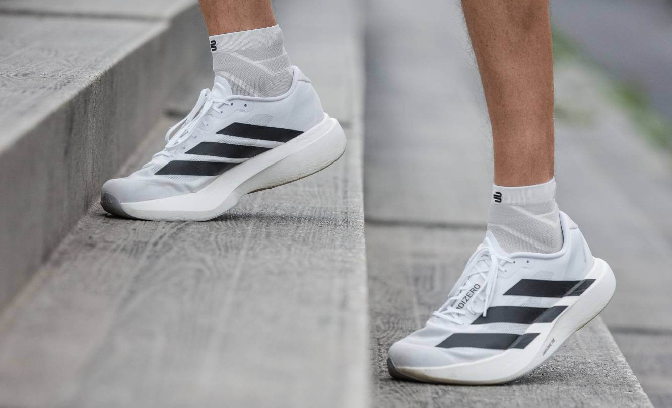 Runner wearing Run Performance Socks running up steps