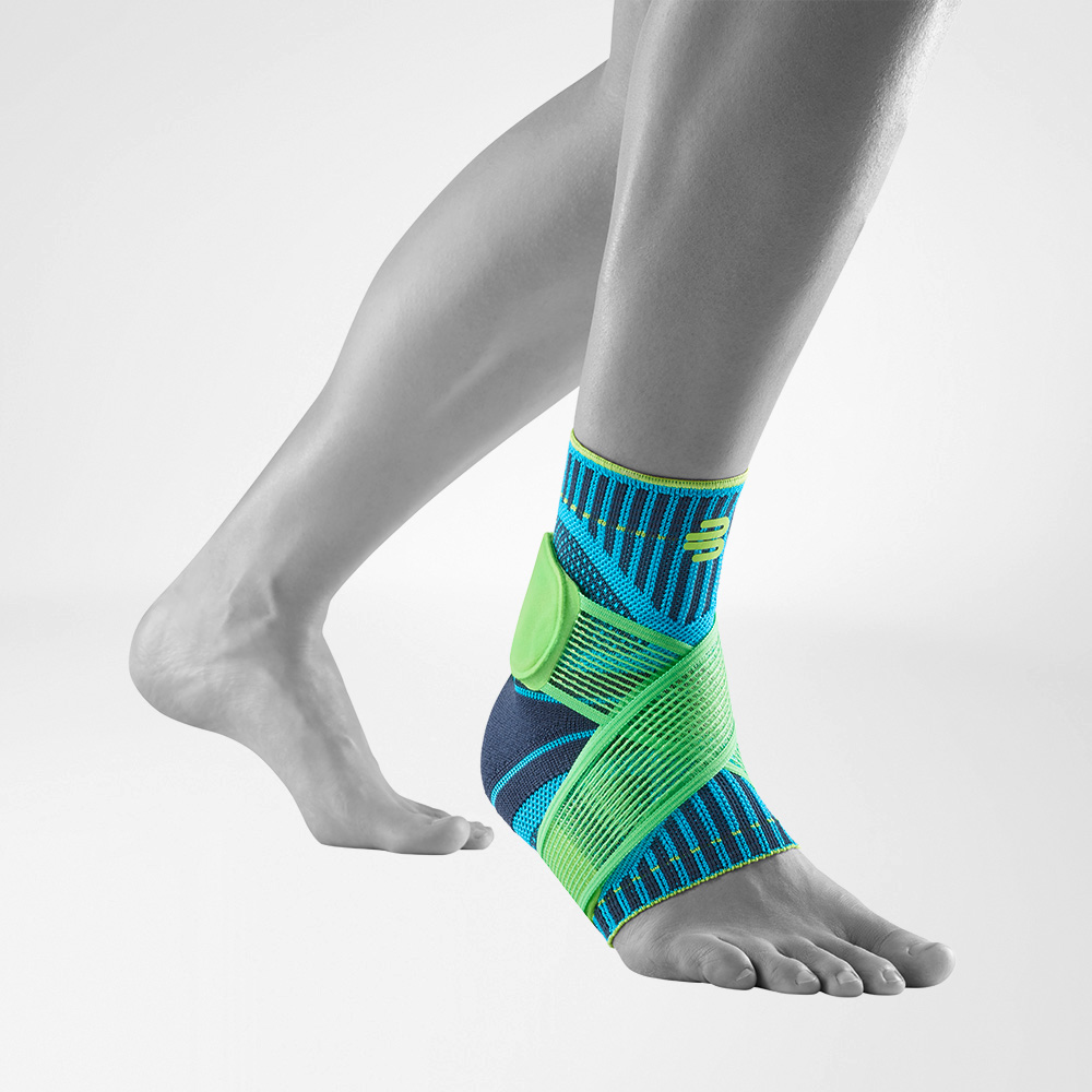 Front-side view of the Sports Ankle Support rivera on a grey foot