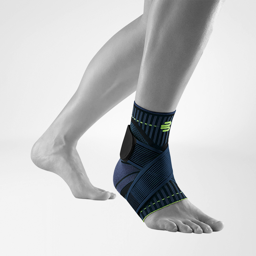 Front-side view of the Sports Ankle Support black on a grey foot