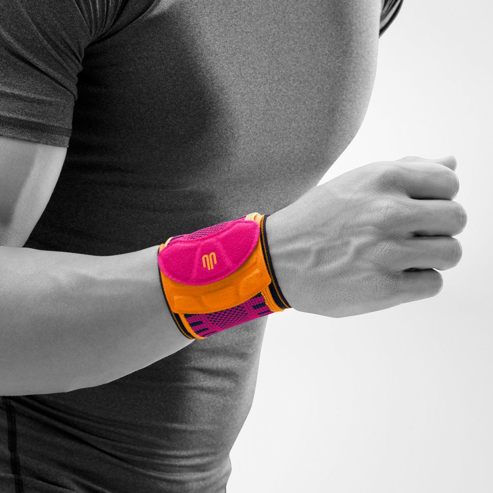 Close-up image of the front of Bauerfeind's Sports Wrist Strap (pink).