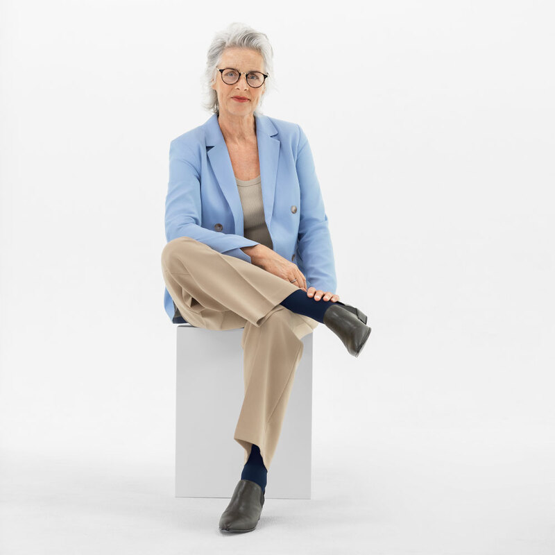 Elegant senior woman wearing VenoTrain business Elegant senior woman wearing VenoTrain business