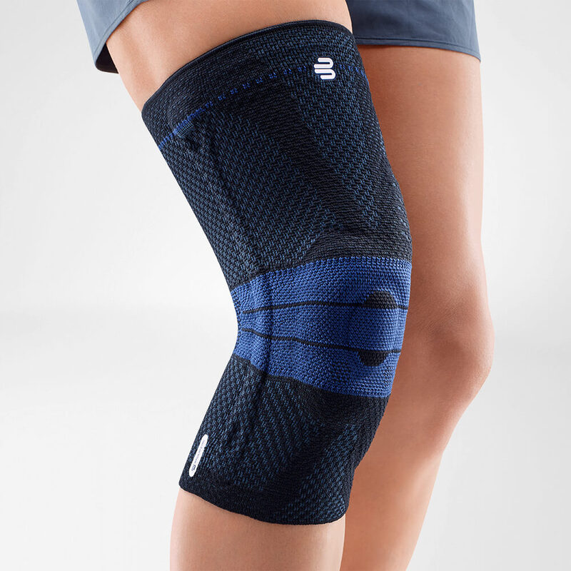 Close-up image of a person wearing Bauerfeind's black GenuTrain A3 arthritis knee brace.