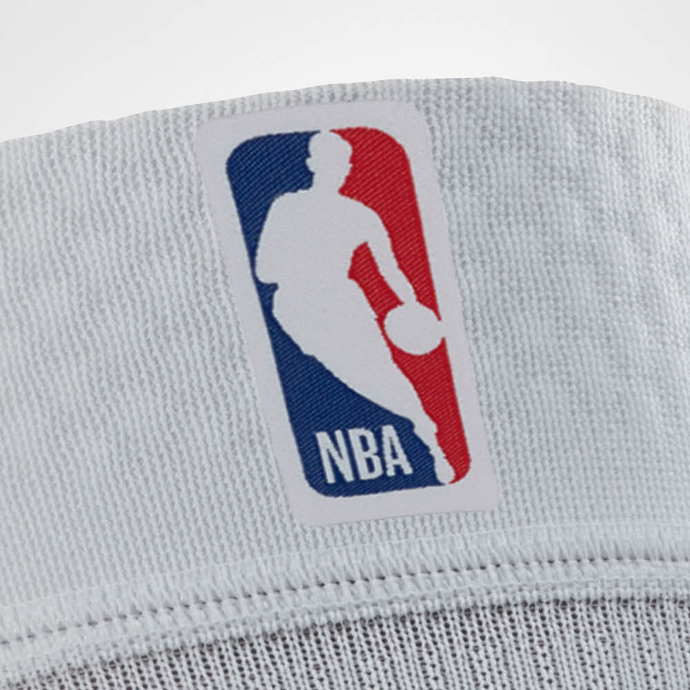 Close-up of NBA logo on white fabric.