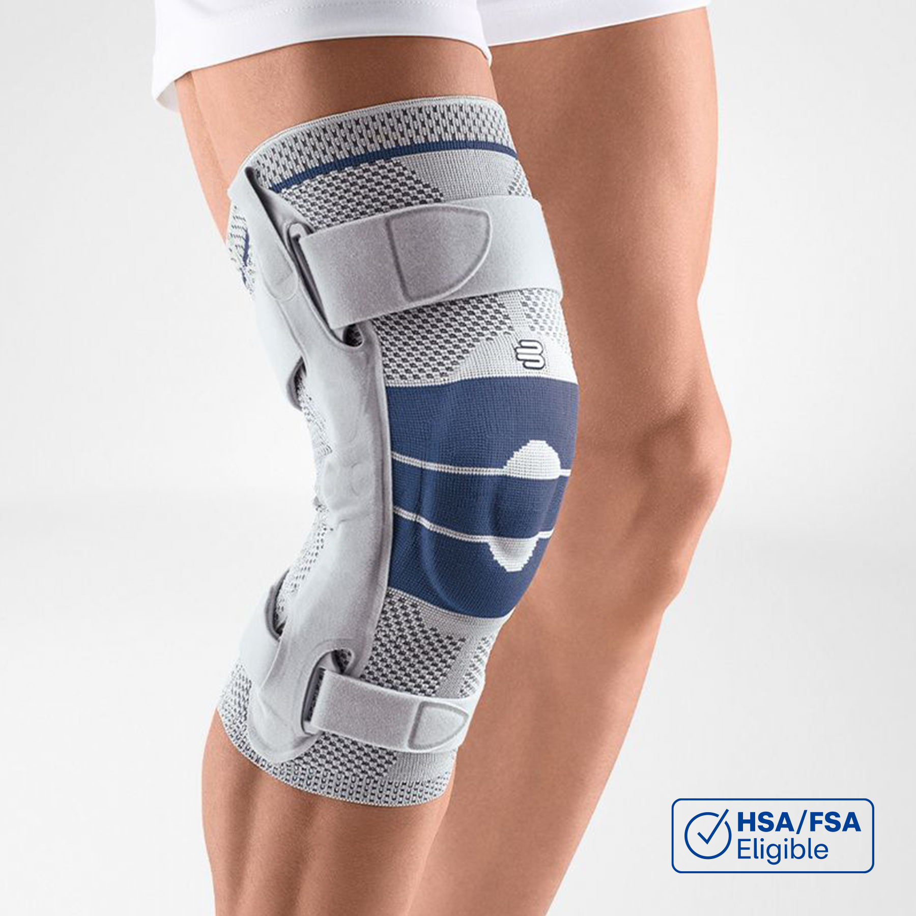 Close-up view of Bauerfeind's titan GenuTrain S hinged knee brace on a person's leg, showcasing adjustable straps and knee pad for joint stability and injury recovery.