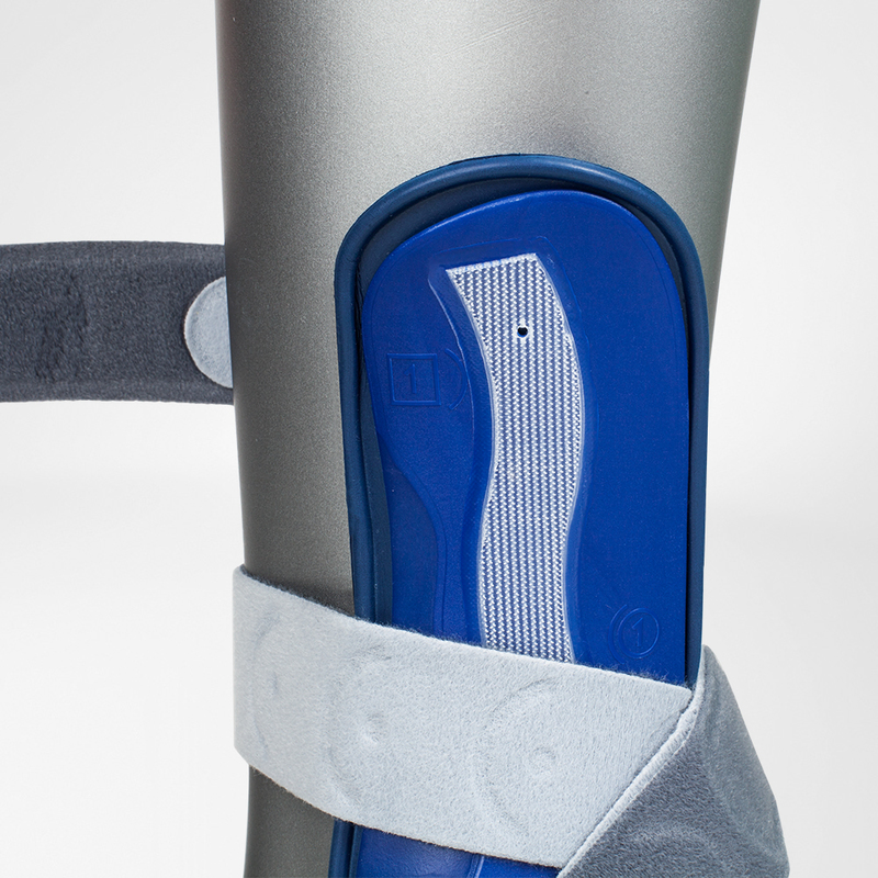 Easy Donning  Close-up of a blue MalleoLoc Ankle Stirrup Brace with gray Velcro straps.