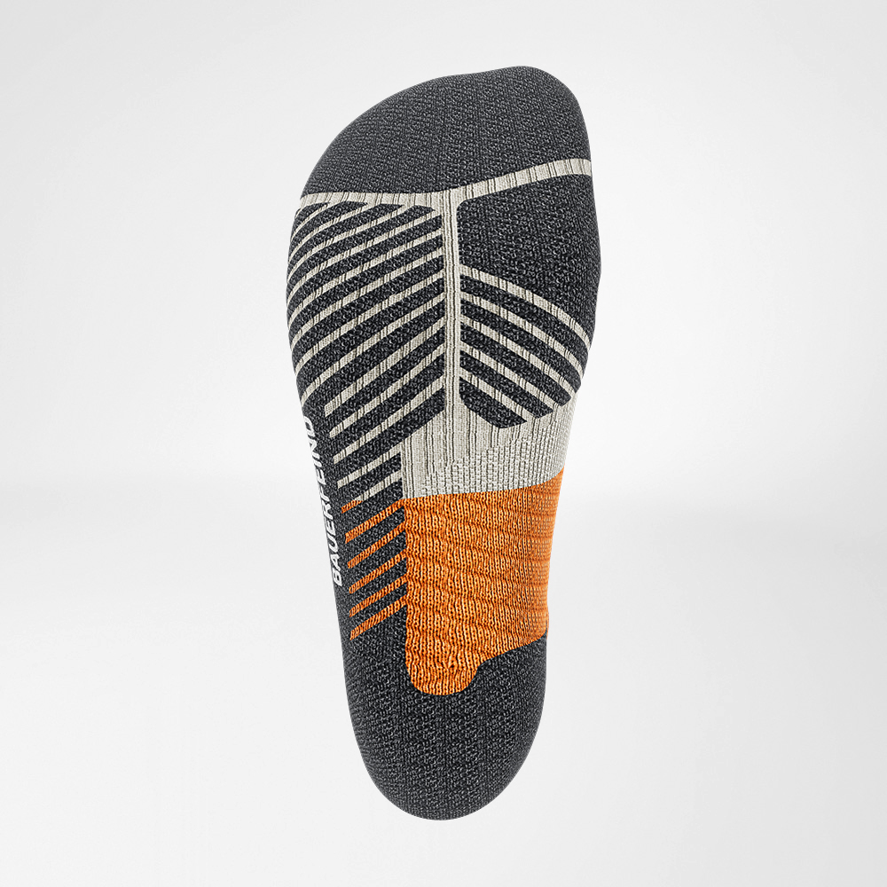 Close-up view of a high-performance athletic sock with grey, black, and orange design, featured on a white background.
