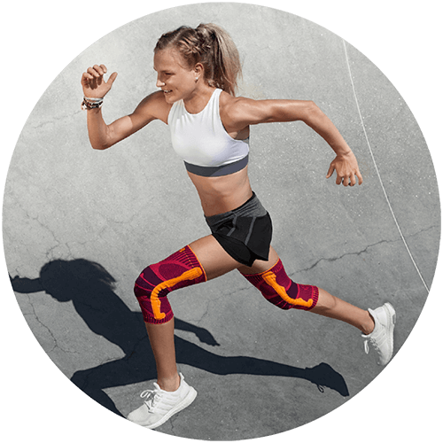 Improves Confidence Woman running on concrete while wearing Bauerfeind's Sports Knee Support.