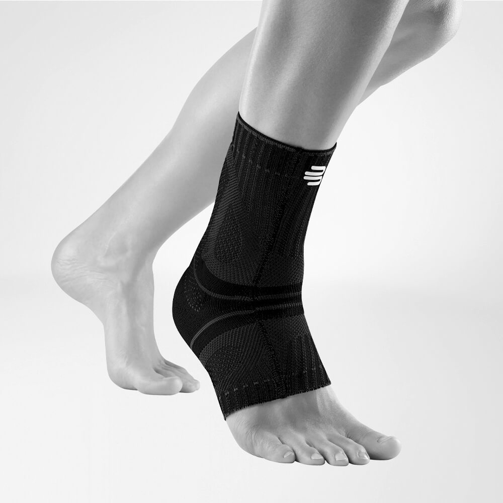 Black achilles brace on foot and lower leg for support and injury prevention